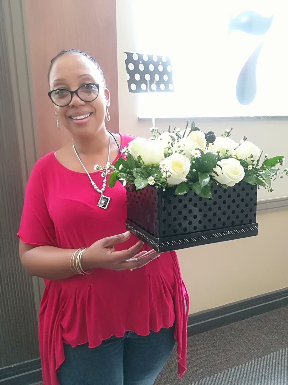 The Flowers by Desire founder with one of her arrangements